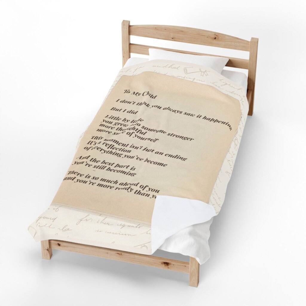 Personalized blanket with becoming message shown in soft natural lighting