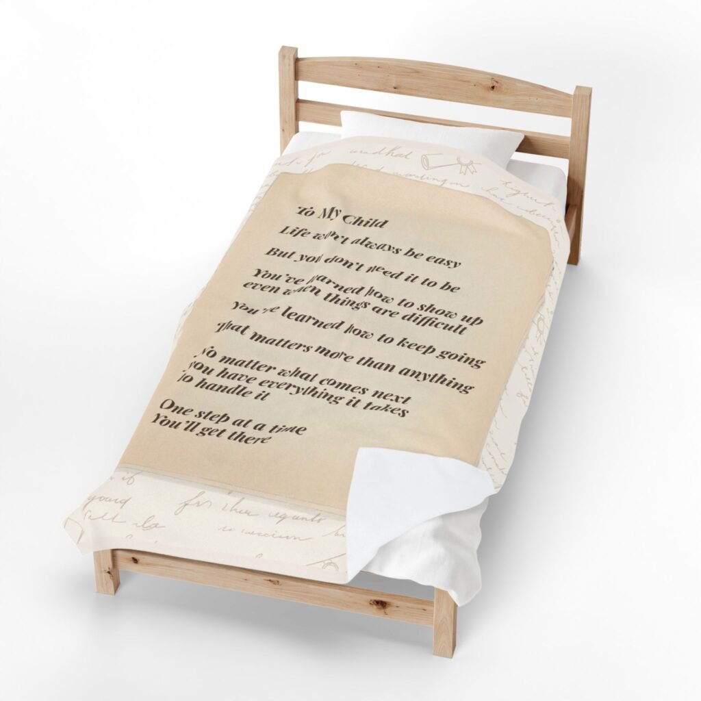 Soft personalized blanket showing encouragement message with warm, calm lighting